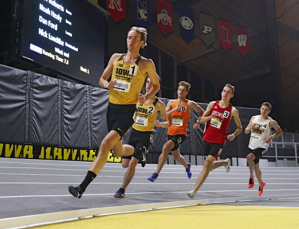 Iowa’s Jeff Roberts (from left) and Noah Healy run the men’s 1 mile run event during the Jimmy Grant Invitational at the Recreation Building in Iowa City on Saturday, December 14, 2019. (Stephen Mally/hawkeyesports.com)