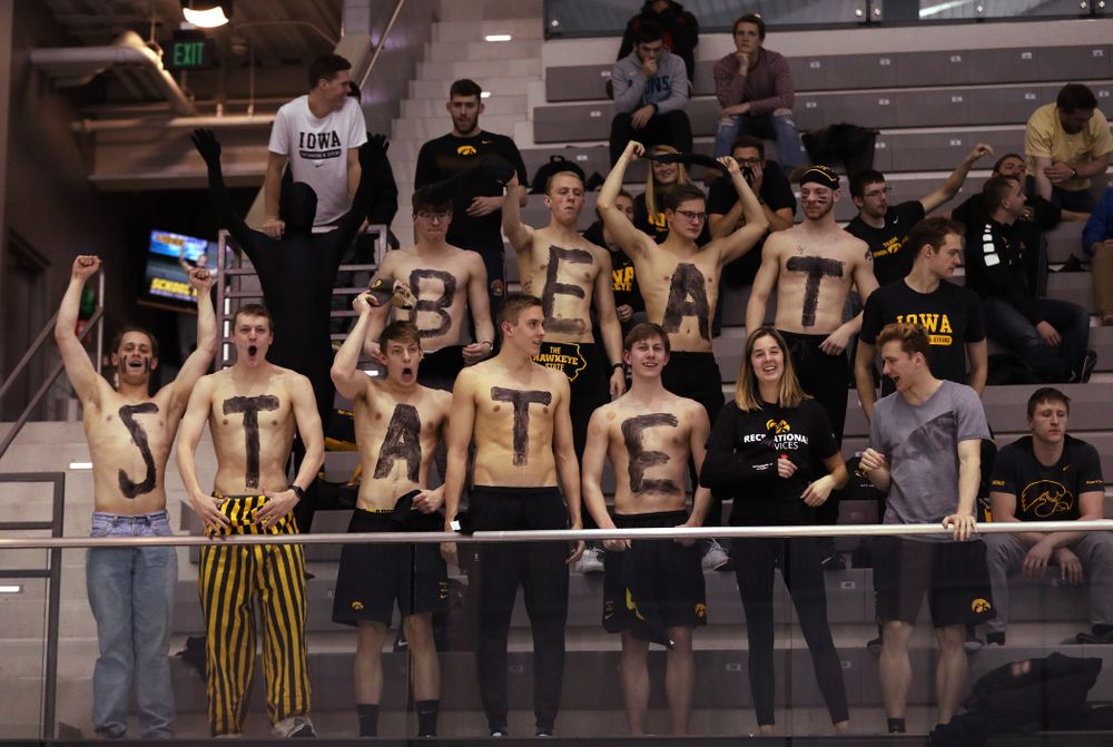 Members of the men's team cheer on the Iowa Hawkeyes women's team against the Iowa State Cyclones in the Iowa Corn Cy-Hawk Series Friday, December 7, 2018 at at the Campus Recreation and Wellness Center. (Brian Ray/hawkeyesports.com)