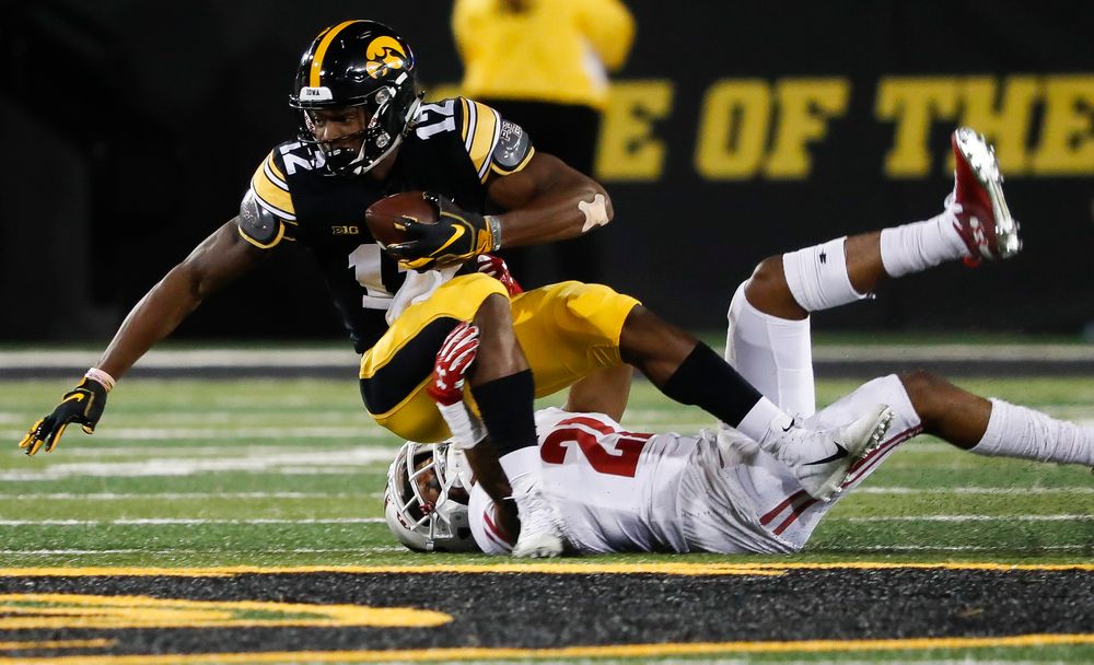 Iowa Hawkeyes wide receiver Brandon Smith (12) is brought down after making a first down reception during a game against Wisconsin at Kinnick Stadium on September 22, 2018. (Tork Mason/hawkeyesports.com)