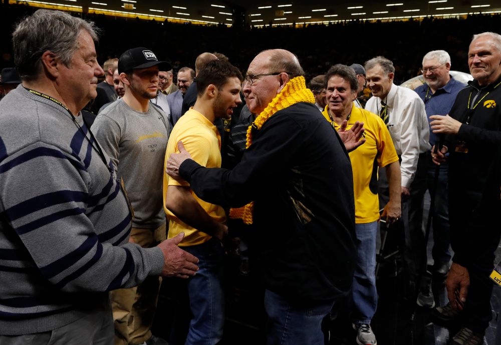 Former Big Ten champions are recognized during the Hawkeyes meet against Minnesota 