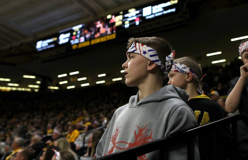 A fan wears a Sorensen Strong headband as he watches Iowa’s Michael Kemerer wrestle Nebraska’s Mickey Labriola at 174 pounds Saturday, January 18, 2020 at Carver-Hawkeye Arena. Kemerer won the match 3-1. (Brian Ray/hawkeyesports.com)