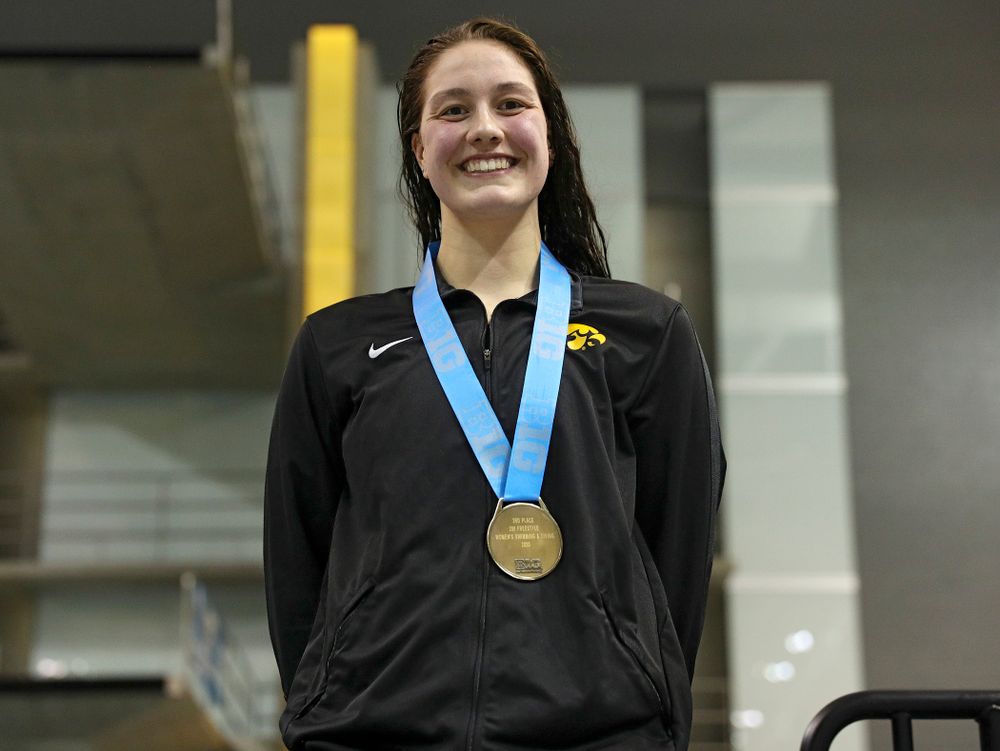 Iowa’s Hannah Burvill on the awards stand after placing third in the women’s 200 yard freestyle final event during the 2020 Women’s Big Ten Swimming and Diving Championships at the Campus Recreation and Wellness Center in Iowa City on Friday, February 21, 2020. (Stephen Mally/hawkeyesports.com)