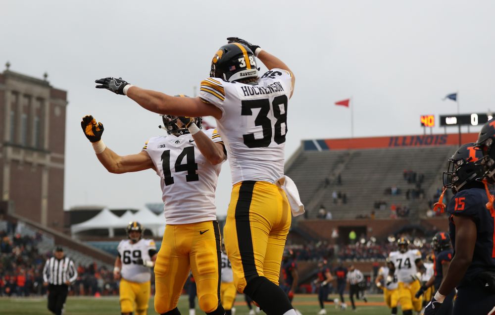 Iowa Hawkeyes tight end T.J. Hockenson (38) celebrates with wide receiver Kyle Groeneweg (14) after scoring against the Illinois Fighting Illini Saturday, November 17, 2018 at Memorial Stadium in Champaign, Ill. (Brian Ray/hawkeyesports.com)