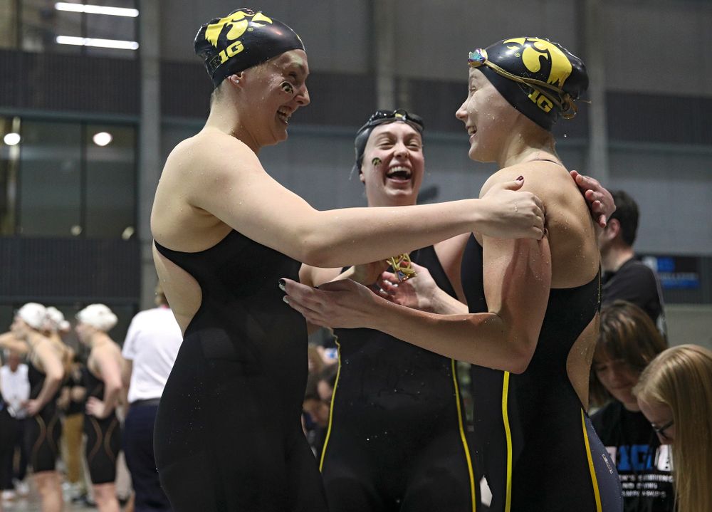 Iowa’s Emilia Sansome, Aleksndra Olesiak, and Kelsey Drake celebrates after setting a school record in the women’s 400 yard medley relay event during the 2020 Women’s Big Ten Swimming and Diving Championships at the Campus Recreation and Wellness Center in Iowa City on Thursday, February 20, 2020. (Stephen Mally/hawkeyesports.com)