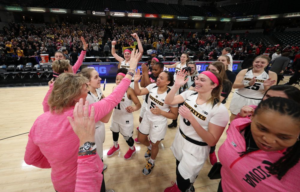 The Iowa Hawkeyes celebrate their victory over the Rutgers Scarlet Knights in the semi-finals of the Big Ten Tournament Saturday, March 9, 2019 at Bankers Life Fieldhouse in Indianapolis, Ind. (Brian Ray/hawkeyesports.com)