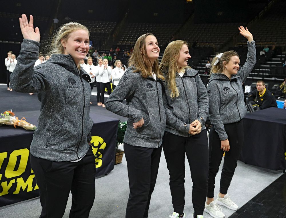 Iowa Field Hockey’s Ryley Miller (from left), Sophie Sunderland, Katie Birch, and Maddy Murphy wave to the crowd at Carver-Hawkeye Arena in Iowa City on Sunday, March 8, 2020. (Stephen Mally/hawkeyesports.com)
