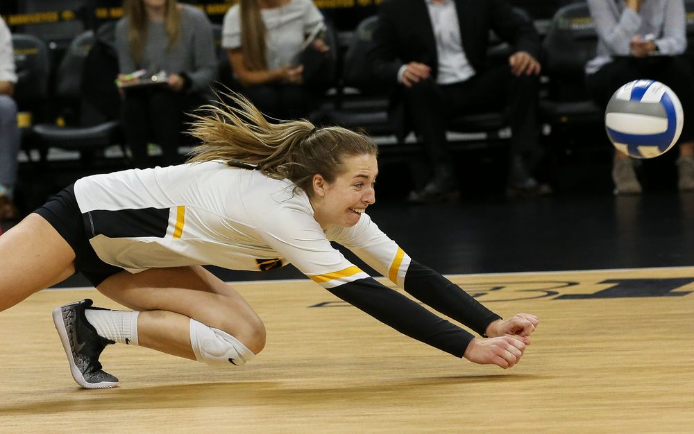 Iowa Hawkeyes outside hitter Meghan Buzzerio (5) dives for a dig during a game against Purdue at Carver-Hawkeye Arena on October 13, 2018. (Tork Mason/hawkeyesports.com)