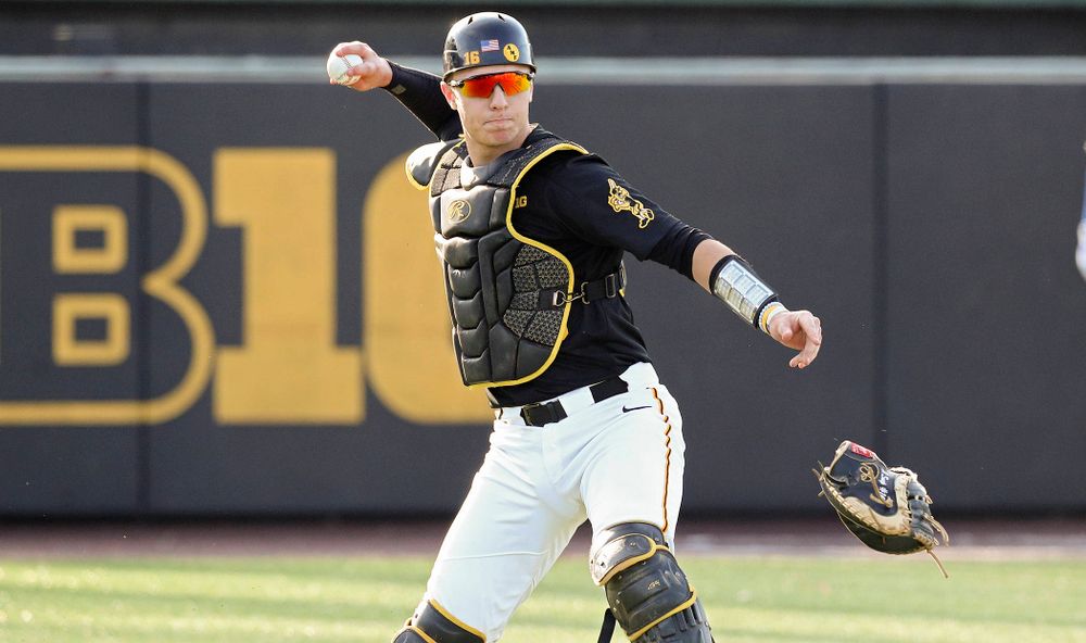 Iowa catcher Tyler Snep (16) throws to first base for an out during the third inning of their college baseball game at Duane Banks Field in Iowa City on Tuesday, March 10, 2020. (Stephen Mally/hawkeyesports.com)