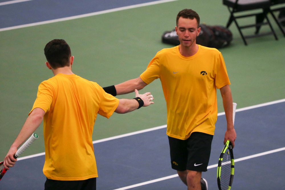 Iowa's Kareem Allaf (right) and Jonas Larsen (left) at a tennis match vs Drake  Friday, March 8, 2019 at the Hawkeye Tennis and Recreation Complex. (Lily Smith/hawkeyesports.com)