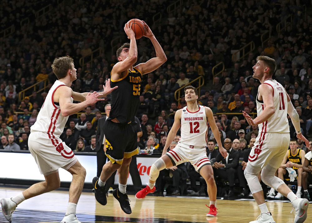 Iowa Hawkeyes center Luka Garza (55) scores a basket inside during the second half of their game at Carver-Hawkeye Arena in Iowa City on Monday, January 27, 2020. (Stephen Mally/hawkeyesports.com)