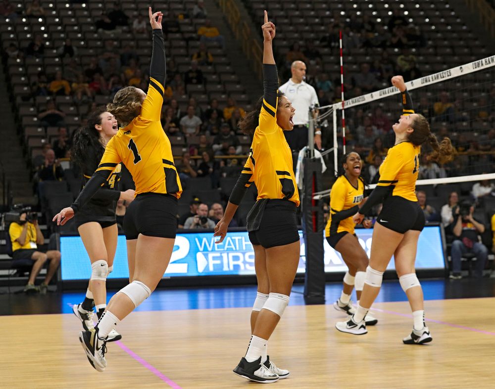 Iowa’s Halle Johnston (4), Joslyn Boyer (1), Brie Orr (7), Griere Hughes (10), and Blythe Rients (11) celebrate a score during their match at Carver-Hawkeye Arena in Iowa City on Sunday, Oct 20, 2019. (Stephen Mally/hawkeyesports.com)