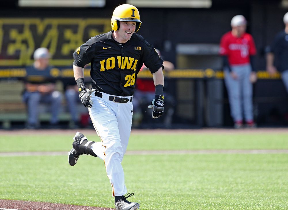 Iowa Hawkeyes left fielder Chris Whelan (28) runs to first on an infield single during the first inning of their game against Rutgers at Duane Banks Field in Iowa City on Saturday, Apr. 6, 2019. (Stephen Mally/hawkeyesports.com)