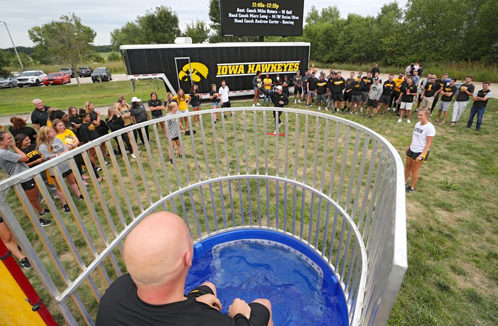 Iowa Baseball assistant coach Robin Lund sits in the dunk tank during the Student-Athlete Kickoff outside the Karro Athletics Hall of Fame Building in Iowa City on Sunday, Aug 25, 2019. (Stephen Mally/hawkeyesports.com)