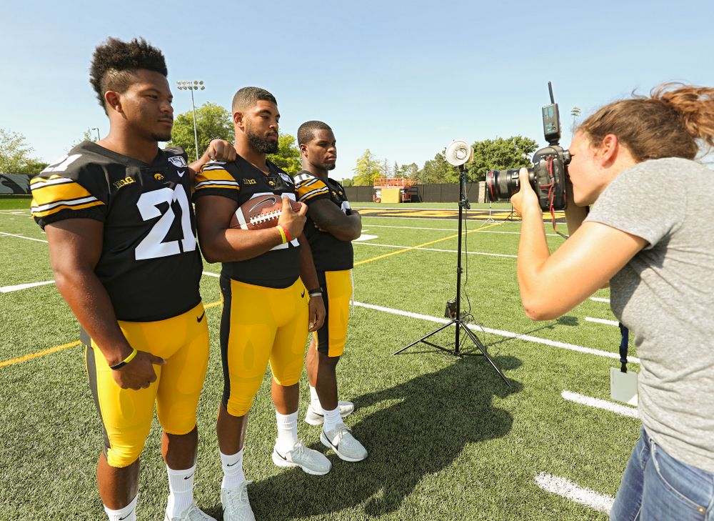 Iowa Hawkeyes running back Ivory Kelly-Martin (21), running back Toren Young (28), and running back Mekhi Sargent (10) pose for a picture during Iowa Football Media Day at the Hansen Football Performance Center in Iowa City on Friday, Aug 9, 2019. (Stephen Mally/hawkeyesports.com)