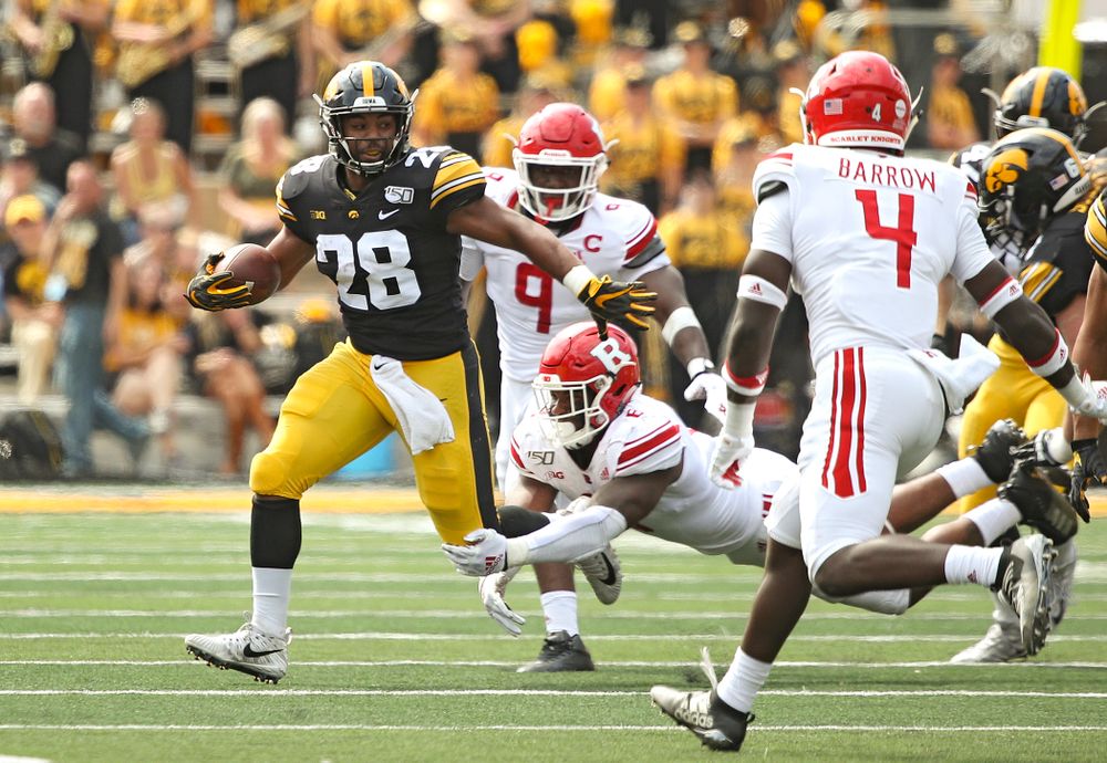 Iowa Hawkeyes running back Toren Young (28) pulls away from a tackle during the second quarter of their Big Ten Conference football game at Kinnick Stadium in Iowa City on Saturday, Sep 7, 2019. (Stephen Mally/hawkeyesports.com)