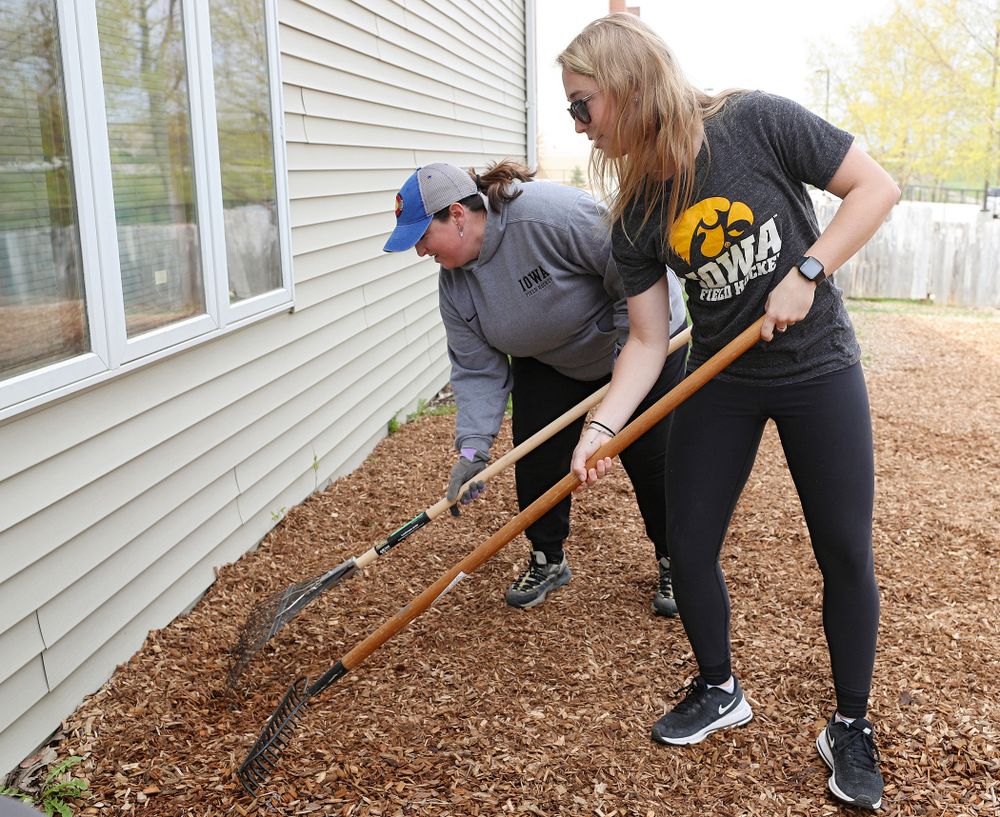 Iowa field hockey players re-mulch the playground at the HACAP Coral Ridge Head Start Center during the 21st annual ISAAC Hawkeye Day of Caring in Coralville on Sunday, Apr. 28, 2019. (Stephen Mally/hawkeyesports.com)