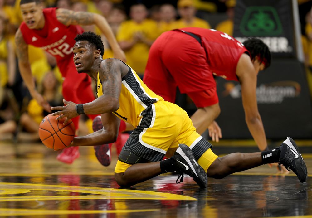 Iowa Hawkeyes guard Joe Toussaint (1) collects a loose ball against the Rutgers Scarlet Knights  Wednesday, January 22, 2020 at Carver-Hawkeye Arena. (Brian Ray/hawkeyesports.com)