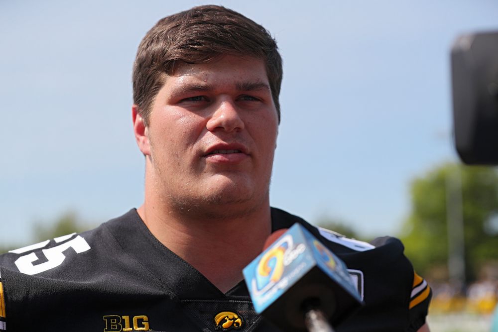 Iowa Hawkeyes offensive lineman Tyler Linderbaum (65) answers questions during Iowa Football Media Day at the Hansen Football Performance Center in Iowa City on Friday, Aug 9, 2019. (Stephen Mally/hawkeyesports.com)