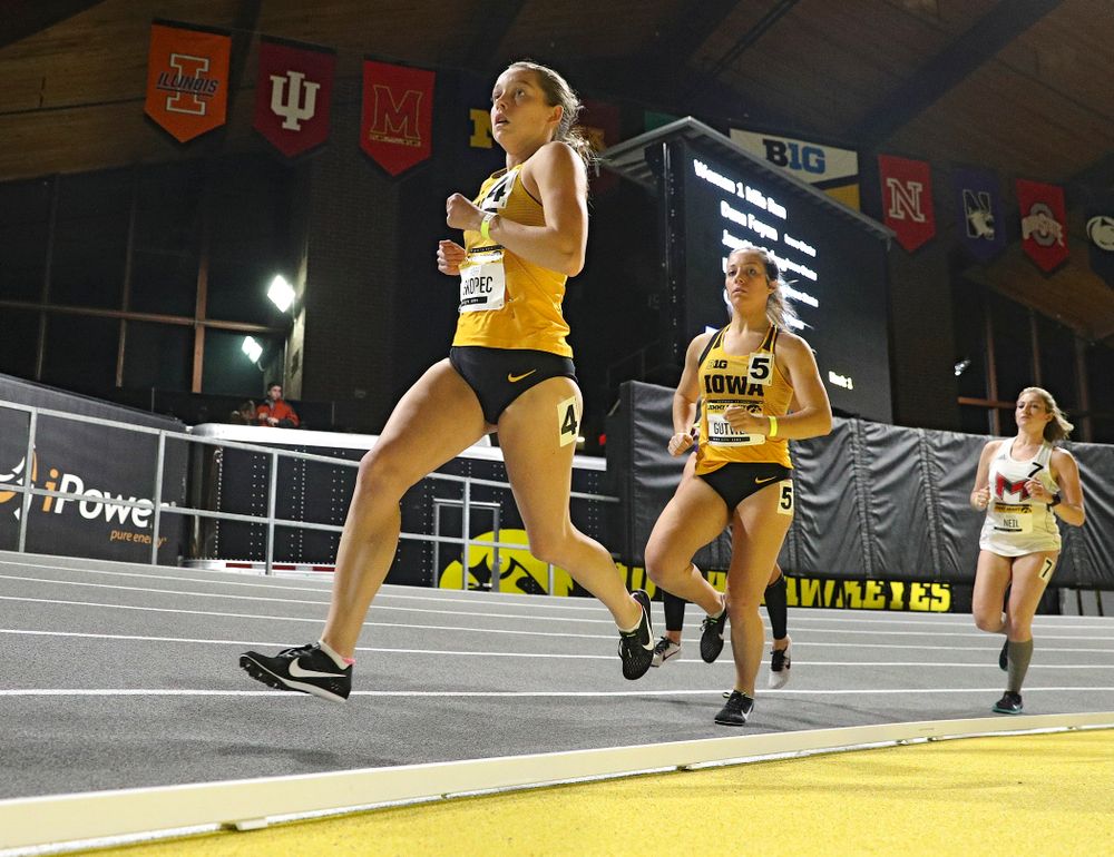 Iowa’s Gabby Skopec (from left) and Maggie Gutwein run the women’s 1 mile run event during the Jimmy Grant Invitational at the Recreation Building in Iowa City on Saturday, December 14, 2019. (Stephen Mally/hawkeyesports.com)