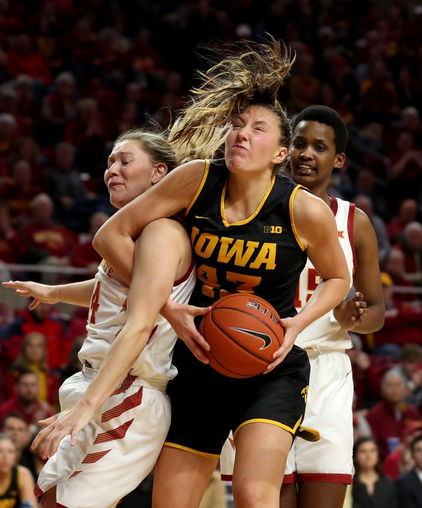Iowa Hawkeyes forward Amanda Ollinger (43) grabs one of her 20 rebounds against the Iowa State Cyclones Wednesday, December 11, 2019 at Hilton Coliseum in Ames, Iowa(Brian Ray/hawkeyesports.com)