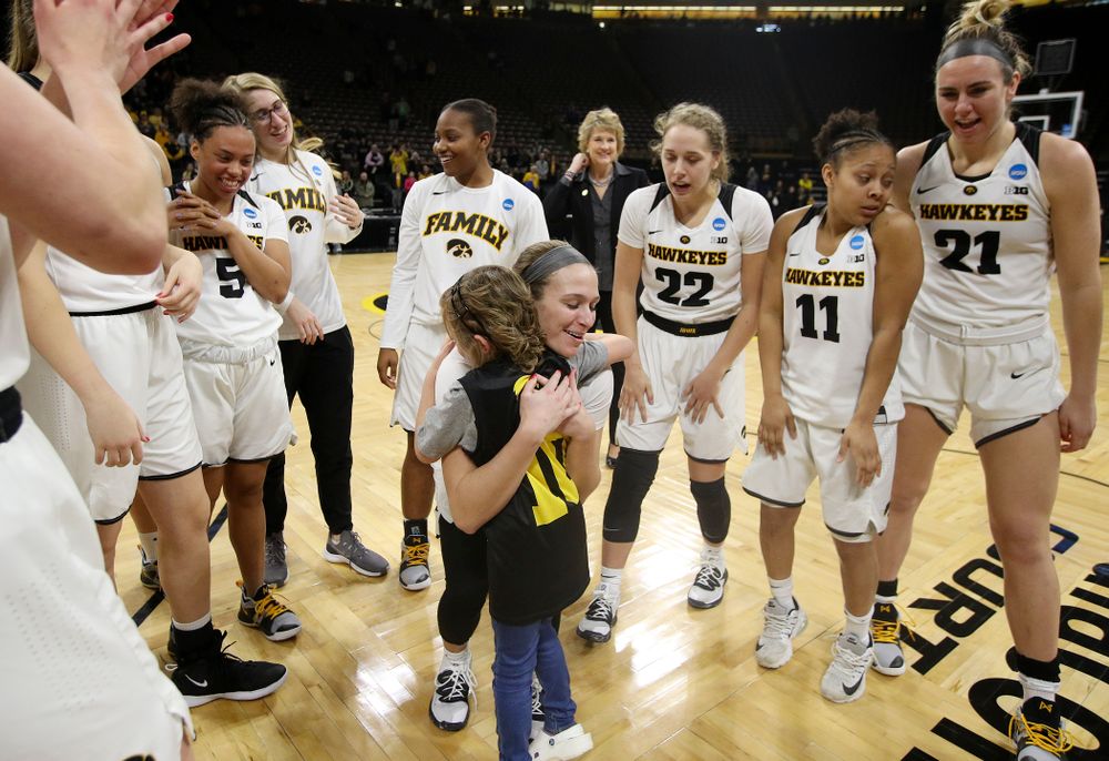 Iowa Hawkeyes guard Makenzie Meyer (3) gets a hug from Harper Stribe after winning their second round game in the 2019 NCAA Women's Basketball Tournament at Carver Hawkeye Arena in Iowa City on Sunday, Mar. 24, 2019. (Stephen Mally for hawkeyesports.com)