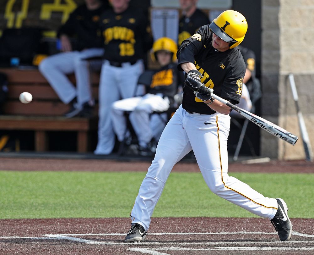 Iowa Hawkeyes first baseman Zeb Adreon (5) hits an RBI double during the fourth inning of their game against Rutgers at Duane Banks Field in Iowa City on Saturday, Apr. 6, 2019. (Stephen Mally/hawkeyesports.com)
