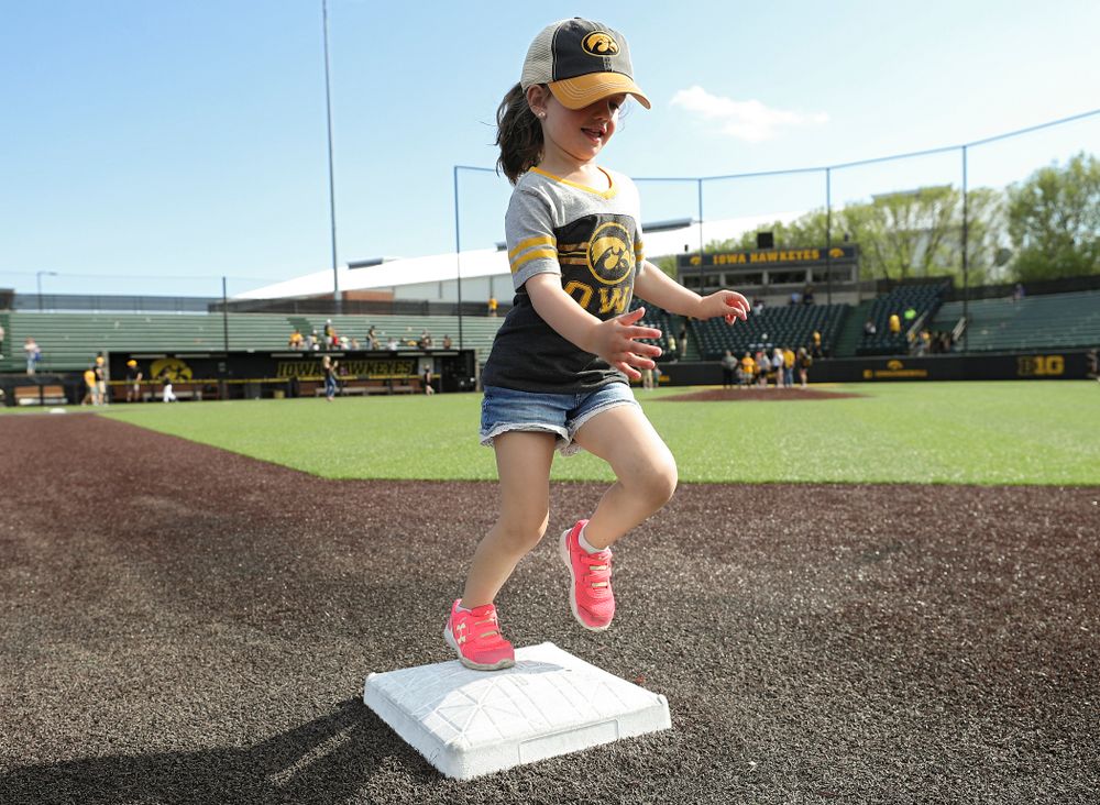 Kids run the bases after Iowa's game against UC Irvine at Duane Banks Field in Iowa City on Sunday, May. 5, 2019. (Stephen Mally/hawkeyesports.com)