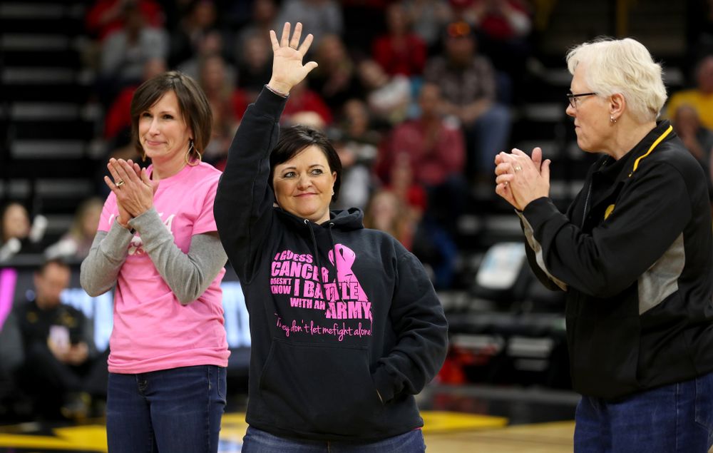 Women affected by cancer are introduced during the Iowa Hawkeyes game against the Wisconsin Badgers Sunday, February 16, 2020 at Carver-Hawkeye Arena. (Brian Ray/hawkeyesports.com)