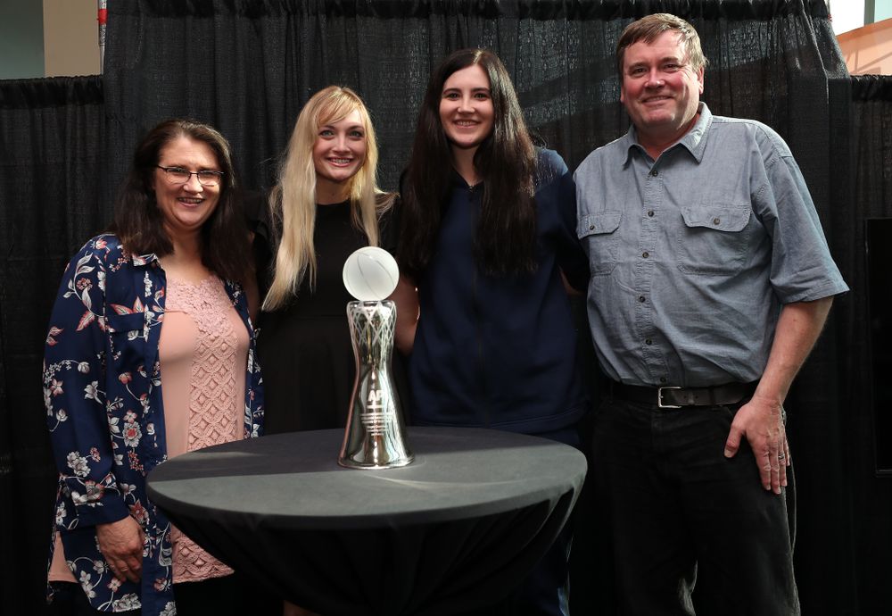 Iowa Hawkeyes forward Megan Gustafson (10) poses for  photo with her family Eva, Clendon, and Emily after winning the Associated Press Player Of The Year during a news conference Thursday, April 4, 2019 at Amalie Arena in Tampa, FL. (Brian Ray/hawkeyesports.com)