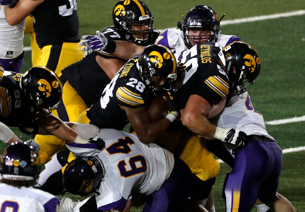 Iowa Hawkeyes running back Toren Young (28) and offensive lineman Ross Reynolds (59) against the Northern Iowa Panthers Saturday, September 15, 2018 at Kinnick Stadium. (Brian Ray/hawkeyesports.com)
