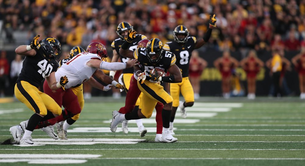 Iowa Hawkeyes defensive end Chauncey Golston (57) recovers a fumble against the Iowa State Cyclones Saturday, September 8, 2018 at Kinnick Stadium. (Max Allen/hawkeyesports.com)