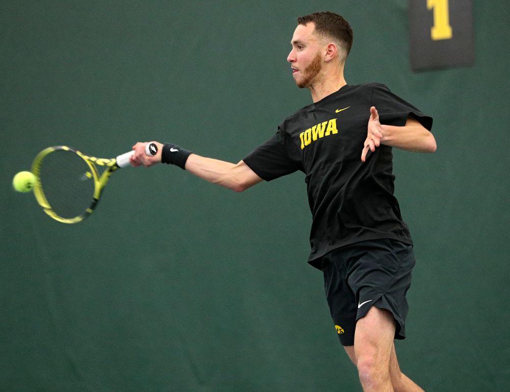 Iowa’s Kareem Allaf returns a shot during his singles match at the Hawkeye Tennis and Recreation Complex in Iowa City on Friday, February 14, 2020. (Stephen Mally/hawkeyesports.com)