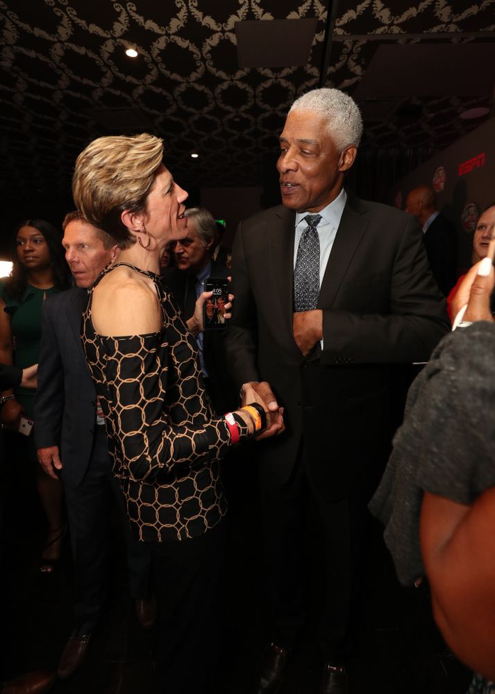 Iowa Hawkeyes associate head coach Jan Jensen with NBA great Julius Erving before the ESPN College Basketball Awards show Friday, April 12, 2019 at The Novo at LA Live.  (Brian Ray/hawkeyesports.com)