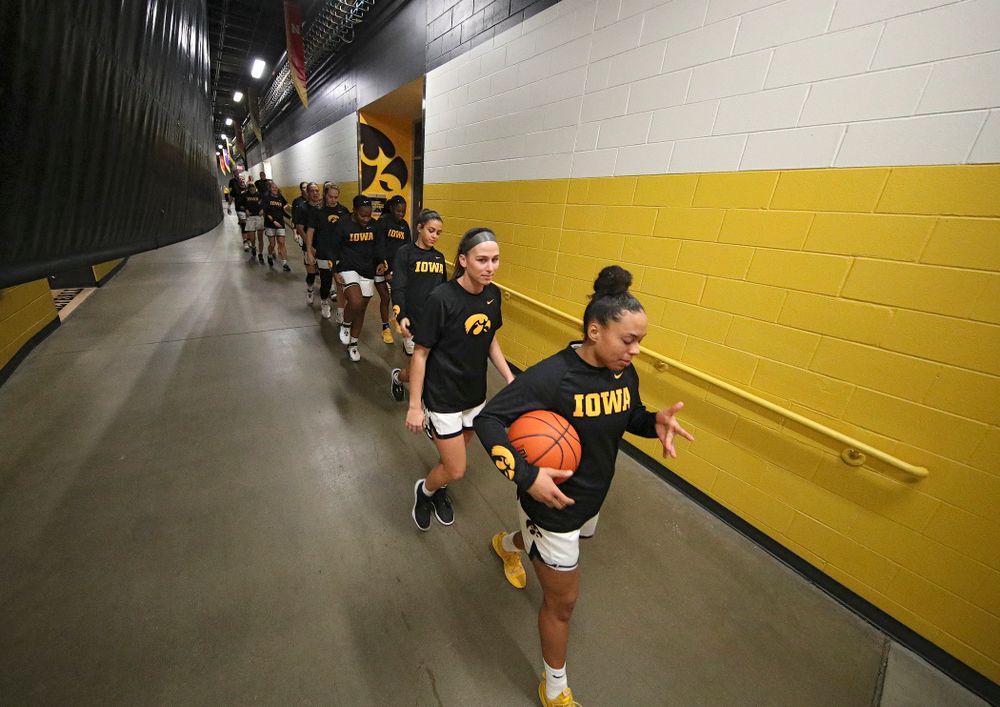 Iowa Hawkeyes guard Alexis Sevillian (5) leads her team to the floor before the start of their game at Carver-Hawkeye Arena in Iowa City on Sunday, January 12, 2020. (Stephen Mally/hawkeyesports.com)