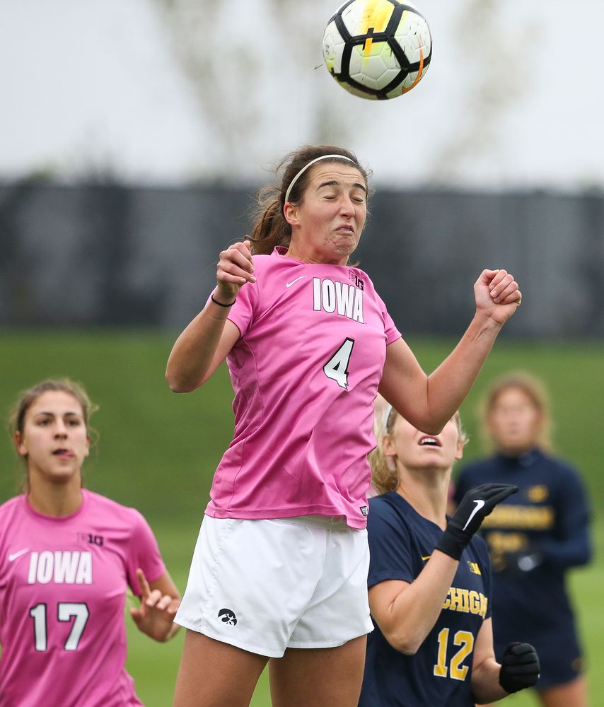 Iowa Hawkeyes forward Kaleigh Haus (4) heads the ball during a game against Michigan at the Iowa Soccer Complex on October 14, 2018. (Tork Mason/hawkeyesports.com)