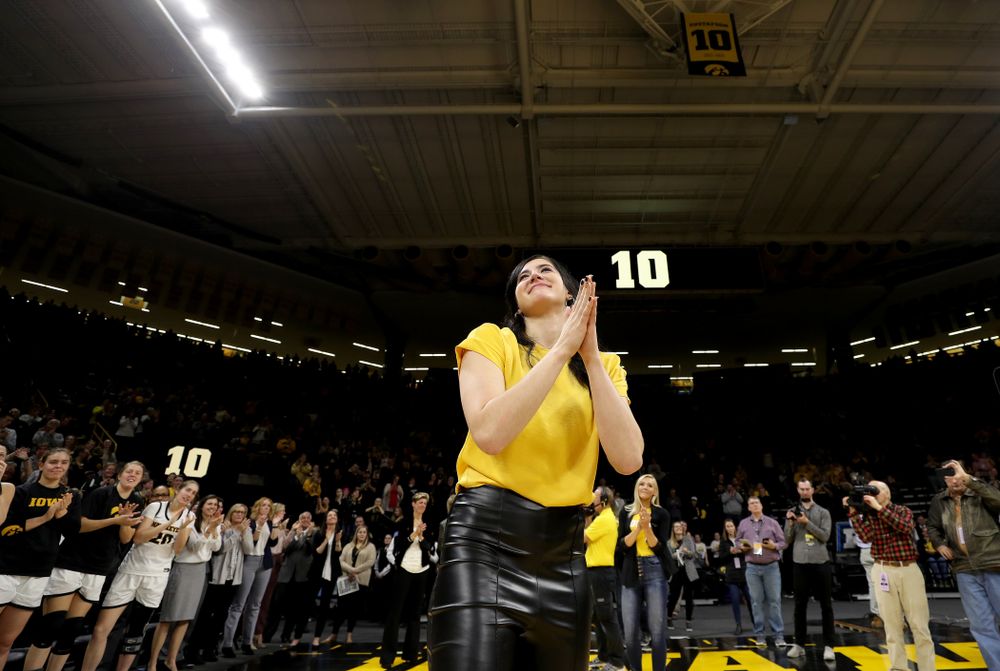 Megan Gustafson waves to the fans after her number was raised into the rafters during a jersey retirement ceremony Sunday, January 26, 2020 at Carver-Hawkeye Arena. (Brian Ray/hawkeyesports.com)