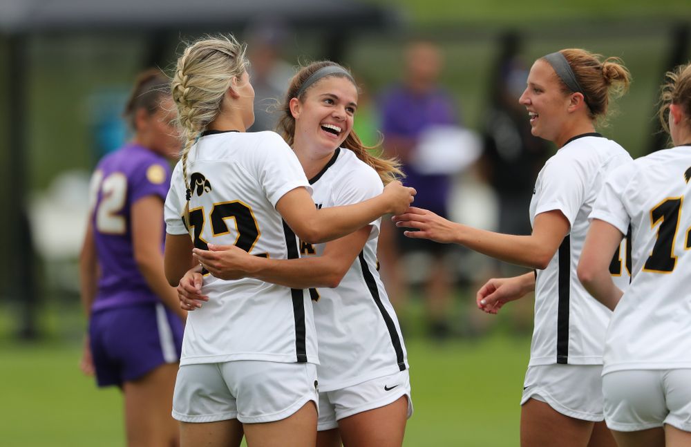 Iowa Hawkeyes forward Gianna Gourley (32) celebrates with Iowa Hawkeyes defender Riley Burns (33) after scoring during a 6-1 win over Northern Iowa Sunday, August 25, 2019 at the Iowa Soccer Complex. (Brian Ray/hawkeyesports.com)