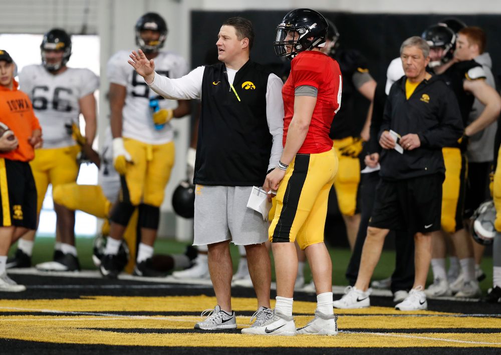 Iowa Hawkeyes offensive coordinator Brian Ferentz and quarterback Nathan Stanley (4) during spring practice Wednesday, March 28, 2018 at the Hansen Football Performance Center.  (Brian Ray/hawkeyesports.com)