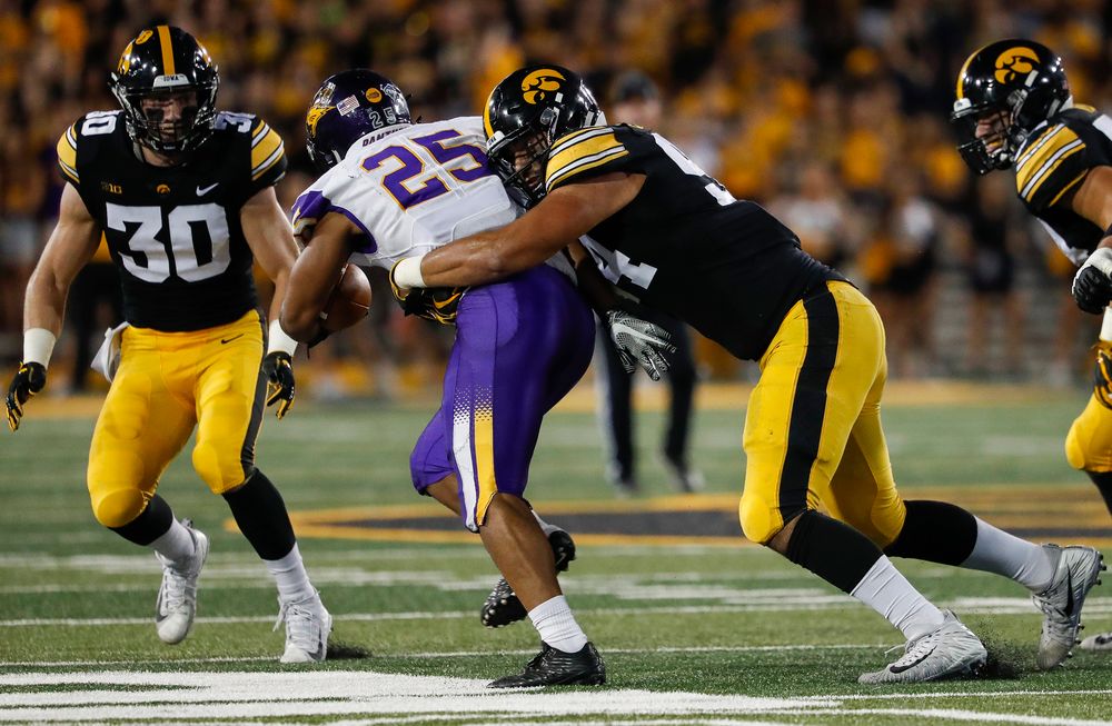 Iowa Hawkeyes defensive end A.J. Epenesa (94) makes a tackle during a game against Northern Iowa at Kinnick Stadium on September 15, 2018. (Tork Mason/hawkeyesports.com)