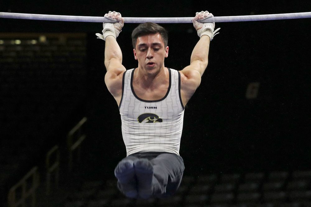 Iowa's Andrew Herrador competes in the parallel bars during the second day of the Big Ten Men's Gymnastics Championships at Carver-Hawkeye Arena in Iowa City on Saturday, Apr. 6, 2019. (Stephen Mally/hawkeyesports.com)