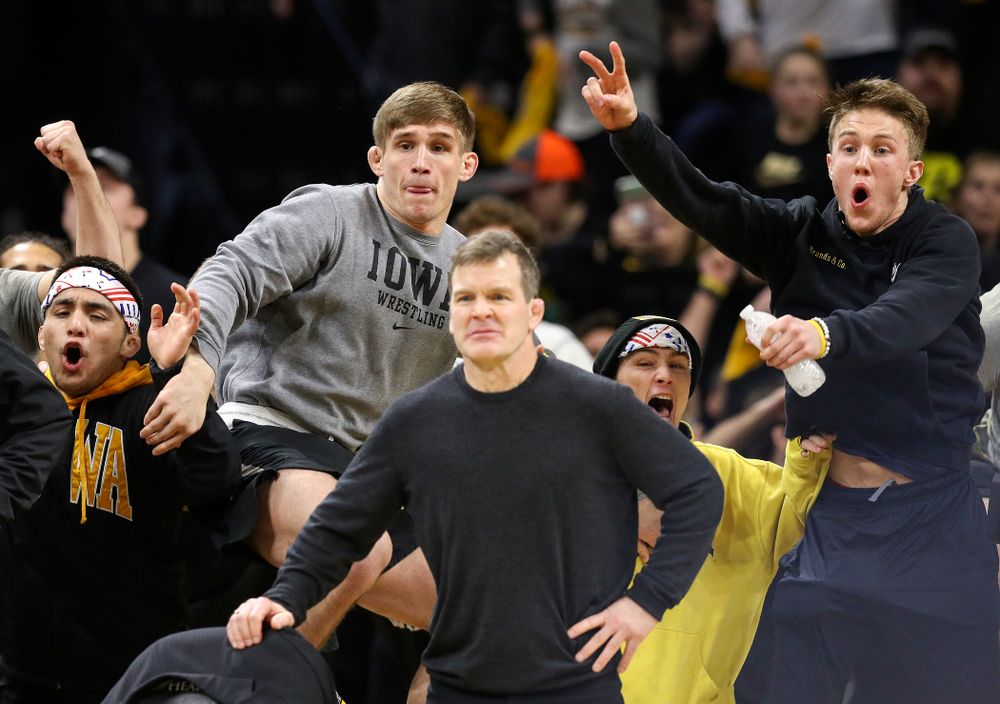 The Iowa bench cheers on cheers on Michael Kemerer in his 174-pound match during their dual at Carver-Hawkeye Arena in Iowa City on Friday, January 31, 2020. (Stephen Mally/hawkeyesports.com)