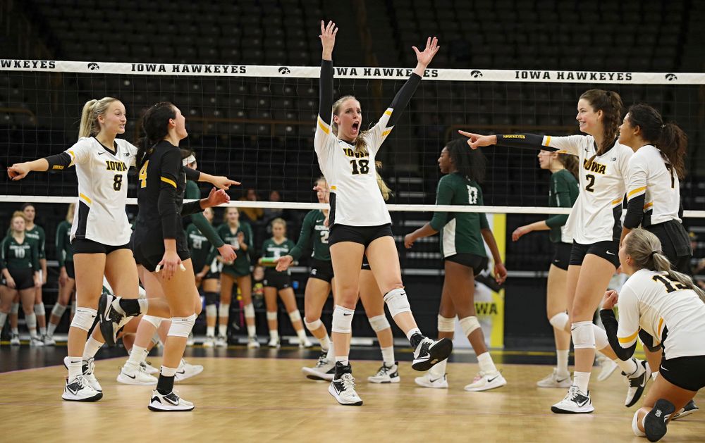 Iowa’s Kyndra Hansen (8), Halle Johnston (4), Hannah Clayton (18), Courtney Buzzerio (2), Maddie Slagle (15), and Brie Orr (7) celebrate a score during the fourth set of their volleyball match at Carver-Hawkeye Arena in Iowa City on Sunday, Oct 13, 2019. (Stephen Mally/hawkeyesports.com)