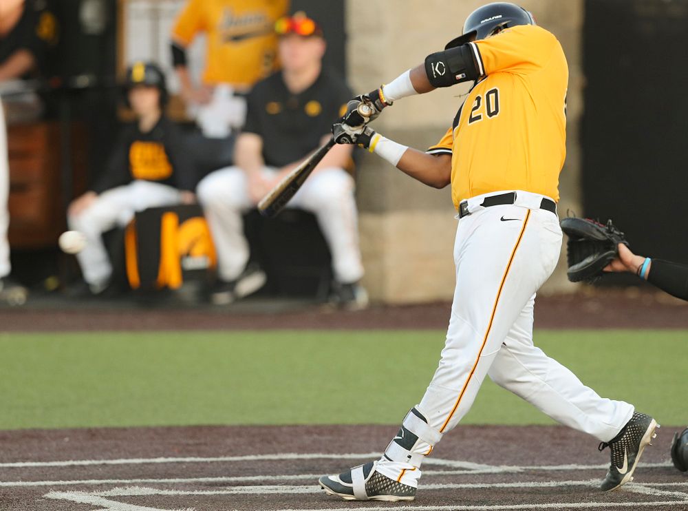 Iowa Hawkeyes first baseman Izaya Fullard (20) hits an RBI single during the eighth inning of their game against Northern Illinois at Duane Banks Field in Iowa City on Tuesday, Apr. 16, 2019. (Stephen Mally/hawkeyesports.com)