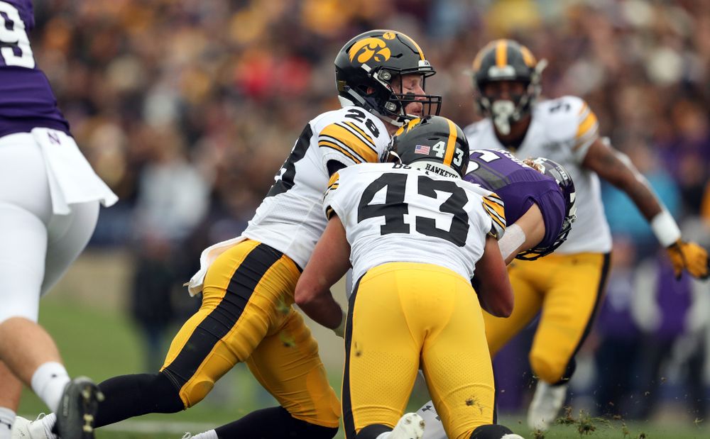 Iowa Hawkeyes defensive back Jack Koerner (28) and linebacker Dillon Doyle (43) against the Northwestern Wildcats Saturday, October 26, 2019 at Ryan Field in Evanston, Ill. (Brian Ray/hawkeyesports.com)