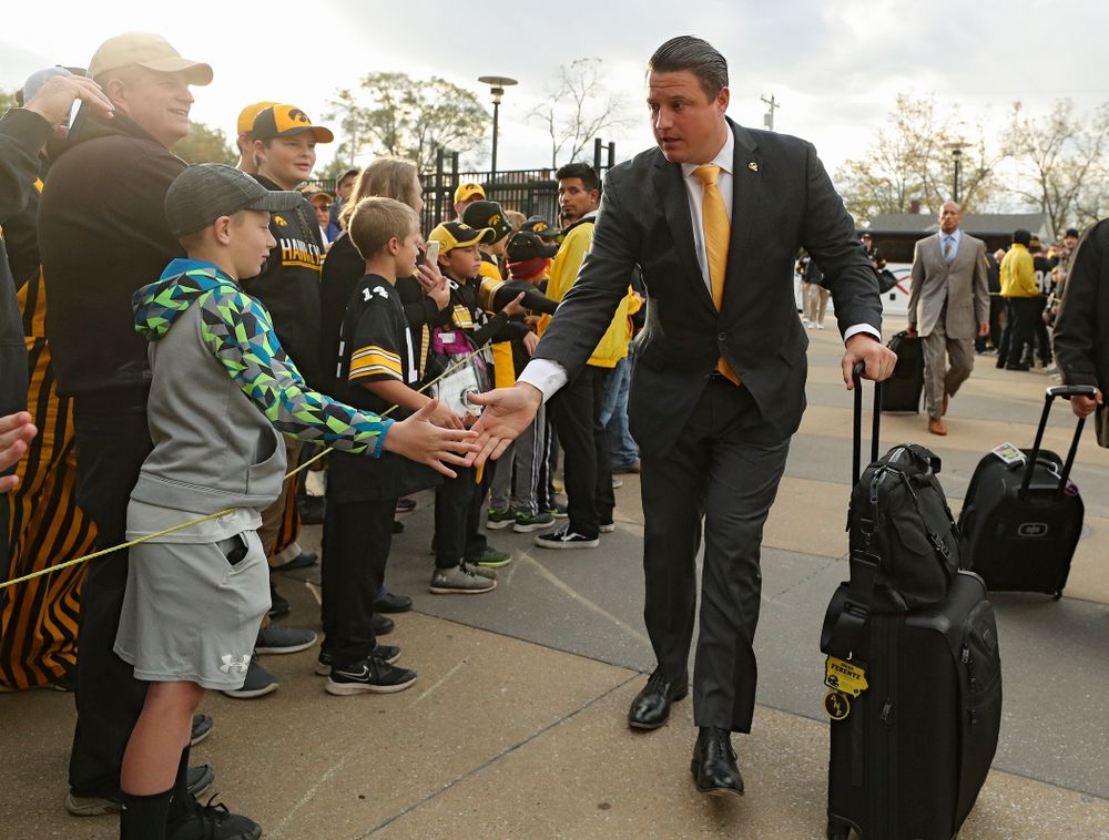 Iowa Hawkeyes offensive coordinator Brian Ferentz greets fans as he arrives with his team before their game at Kinnick Stadium in Iowa City on Saturday, Oct 19, 2019. (Stephen Mally/hawkeyesports.com)