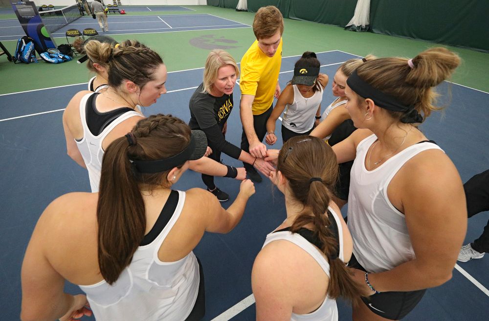 The Hawkeyes huddle before their match at the Hawkeye Tennis and Recreation Complex in Iowa City on Sunday, February 23, 2020. (Stephen Mally/hawkeyesports.com)