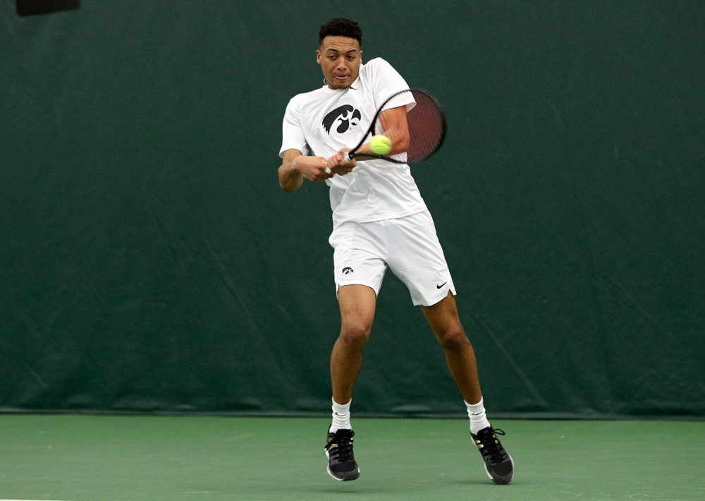 Iowa’s Oliver Okonkwo returns a shot during his doubles match at the Hawkeye Tennis and Recreation Complex in Iowa City on Sunday, February 16, 2020. (Stephen Mally/hawkeyesports.com)