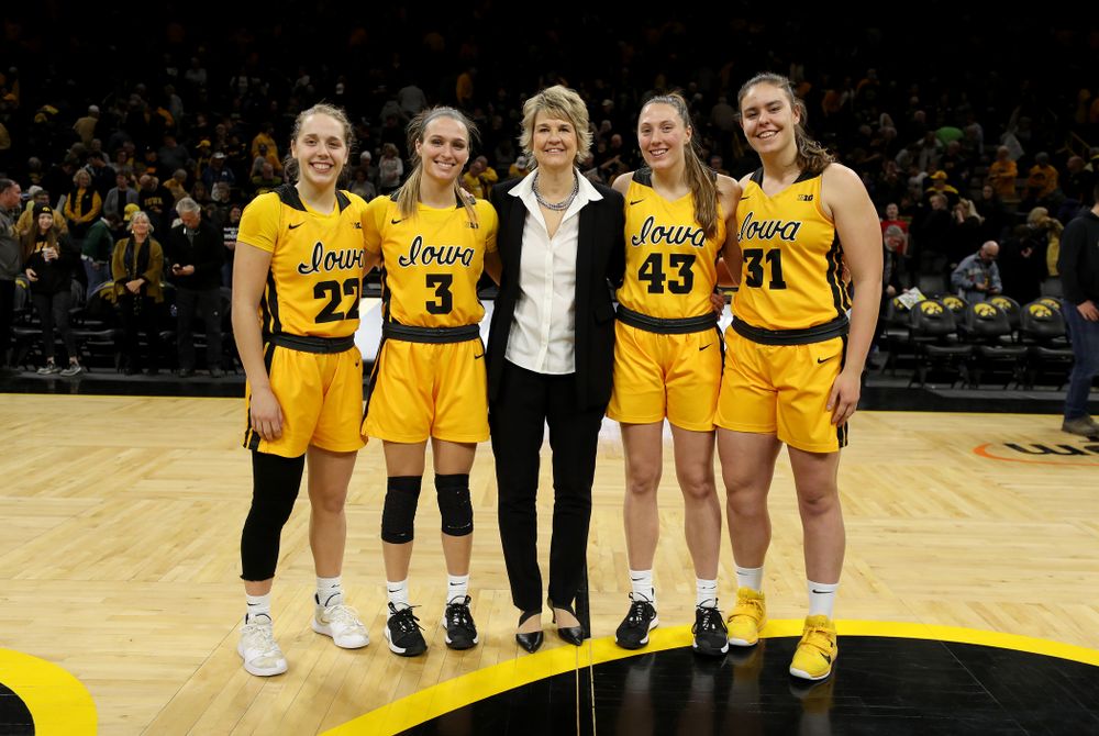 Iowa Hawkeyes head coach Lisa Bluder with seniors Kathleen Doyle, Makenzie Meyer, Amanda Ollinger, and Paula Valiño Ramos during senior day activities following their win over the Minnesota Golden Gophers Thursday, February 27, 2020 at Carver-Hawkeye Arena. (Brian Ray/hawkeyesports.com)