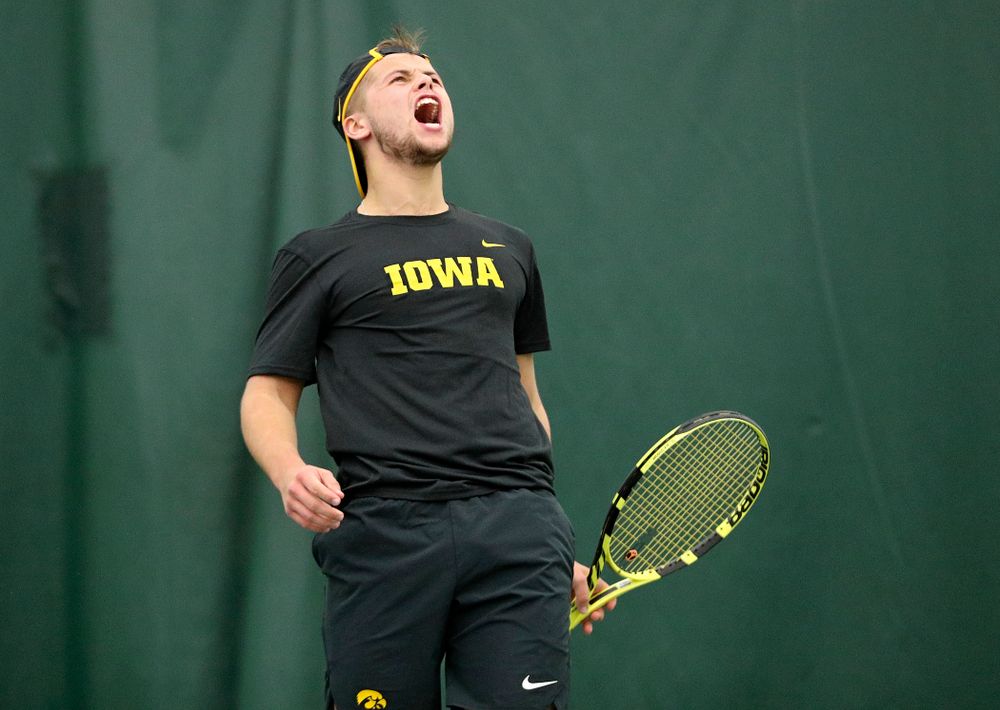 Iowa’s Will Davies celebrates a point during their match at the Hawkeye Tennis and Recreation Complex in Iowa City on Thursday, January 16, 2020. (Stephen Mally/hawkeyesports.com)