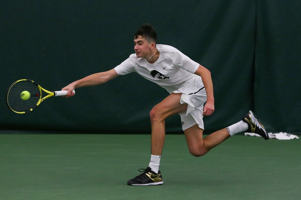 Iowa’s Matt Clegg dives for a forehand during the Iowa men’s tennis match vs Western Michigan on Saturday, January 18, 2020 at the Hawkeye Tennis and Recreation Complex. (Lily Smith/hawkeyesports.com)